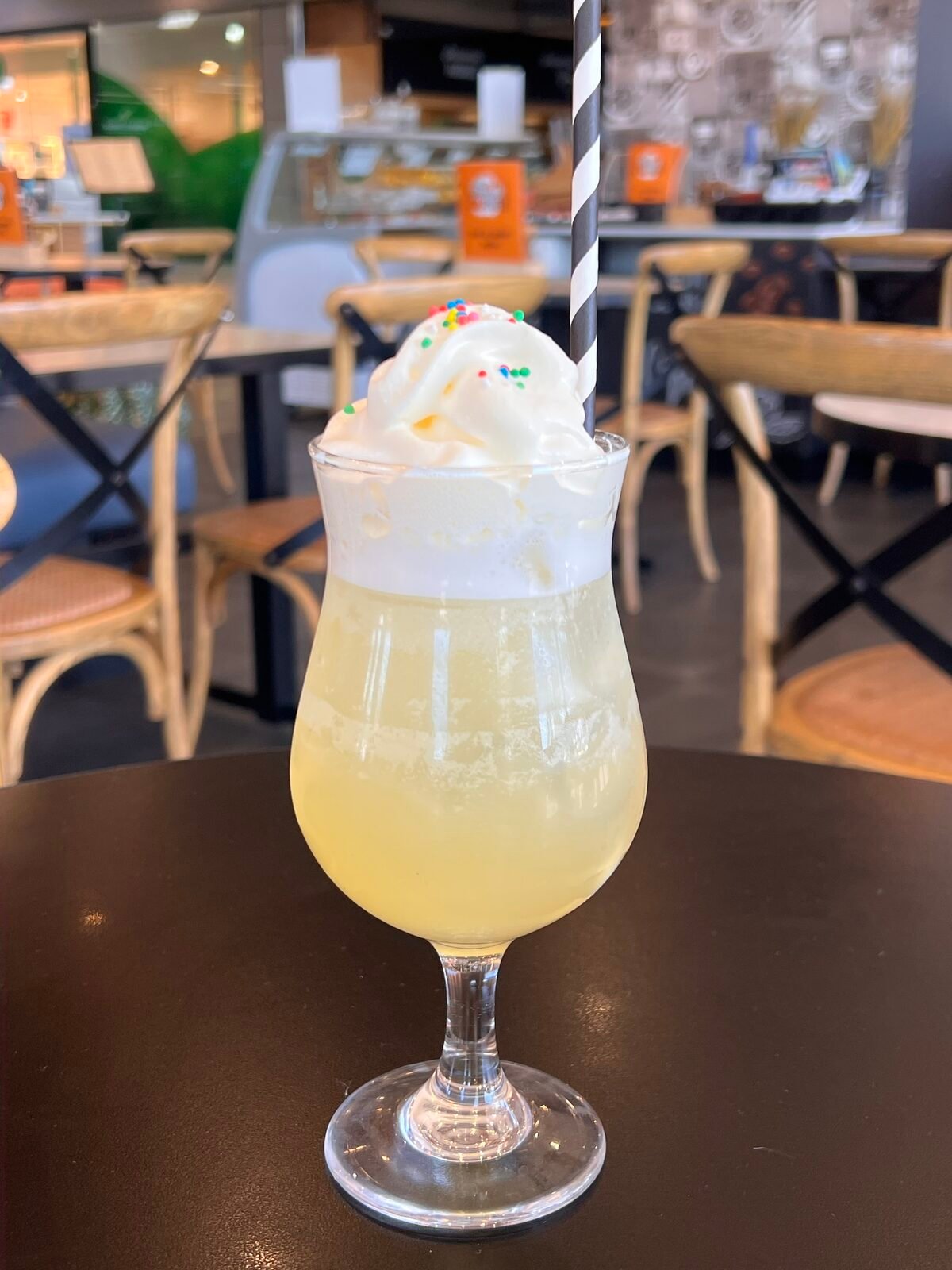Creamsicle drink topped with sprinkles
