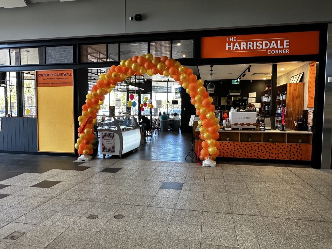Entrance of The Harrisdale Corner with balloon arch